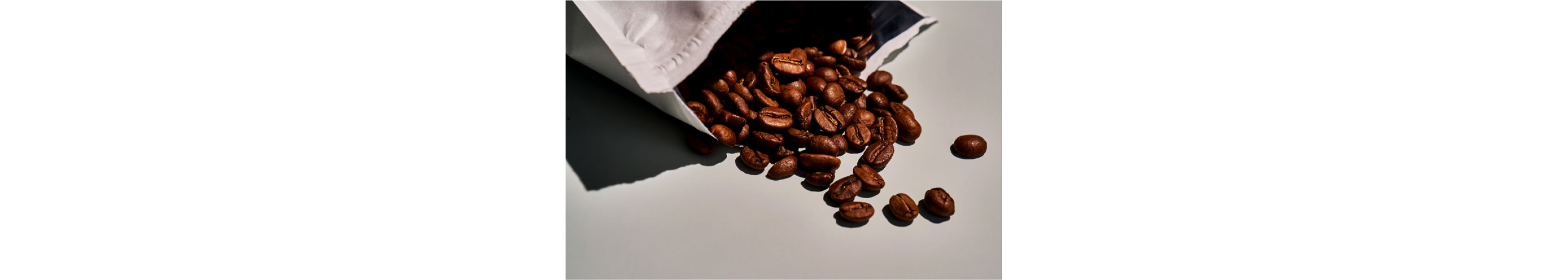 Coffee beans spilling out of a package