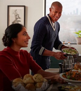 People setting a table for a meal