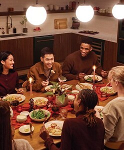 People sitting around a table eating food