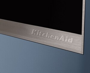 A closeup of the KitchenAid® badge on a range