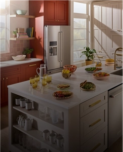 A kitchen with burnt orange cabinets and KitchenAid® appliances.