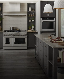 A kitchen with gray cabinets and KitchenAid® appliances.