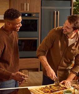 People cooking together at Room to Host