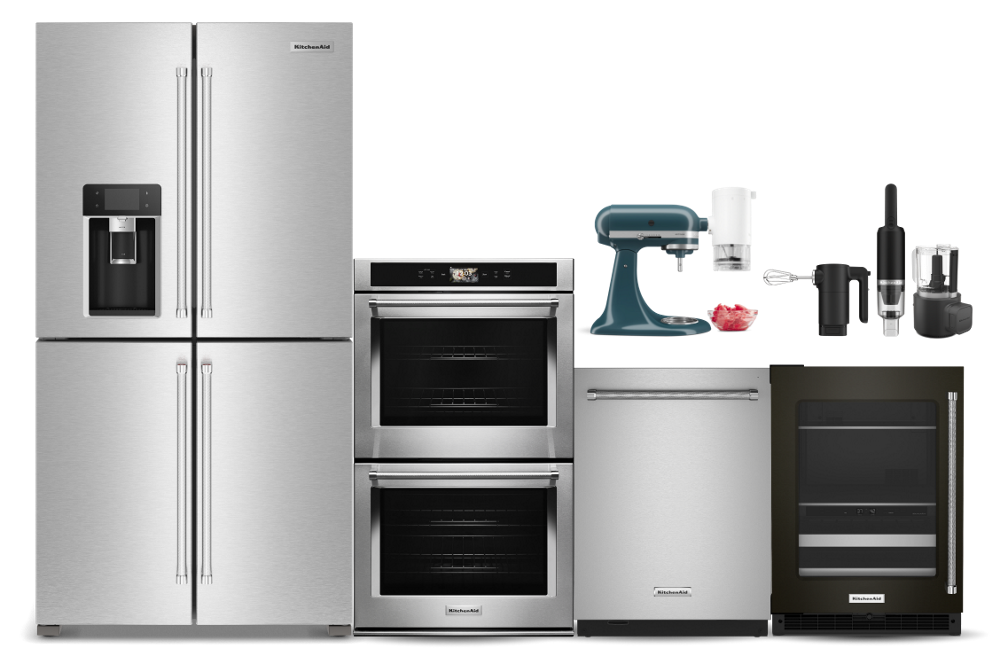 A suite of KitchenAid® appliances, featuring a 4-door refrigerator, double wall oven, dishwasher, undercounter refrigerator and various countertop appliances.