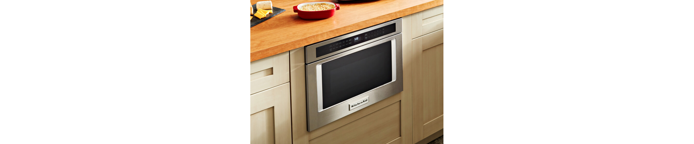  Food on a counter with a microwave drawer below