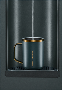 A Corkcicle mug getting filled by The MindFULLness Fridge