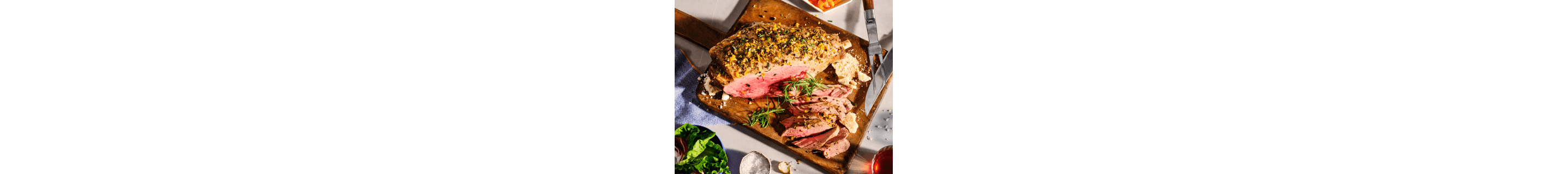 Seasoned meat on a wooden cutting board
