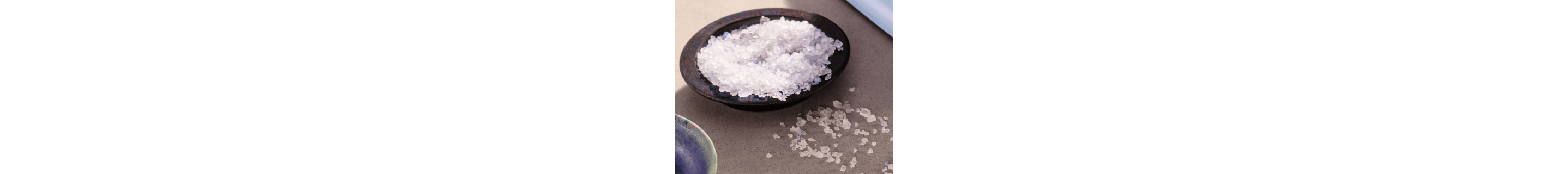 Wooden bowl filled with blue salt
