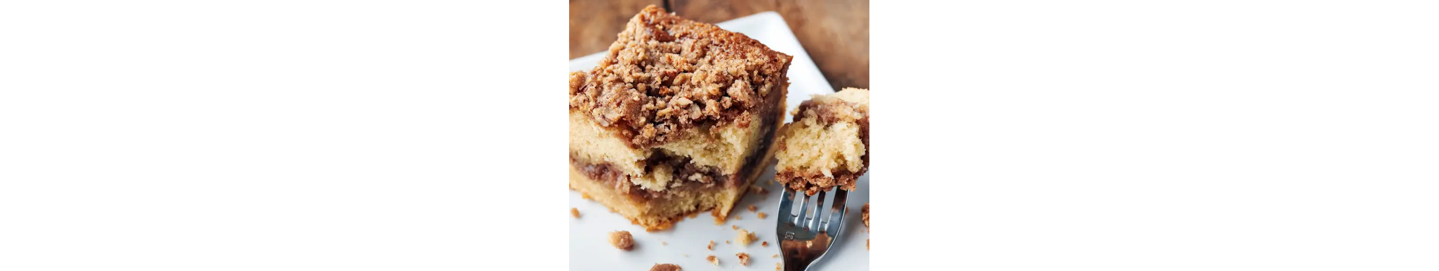 A slice of cake with crumb topping