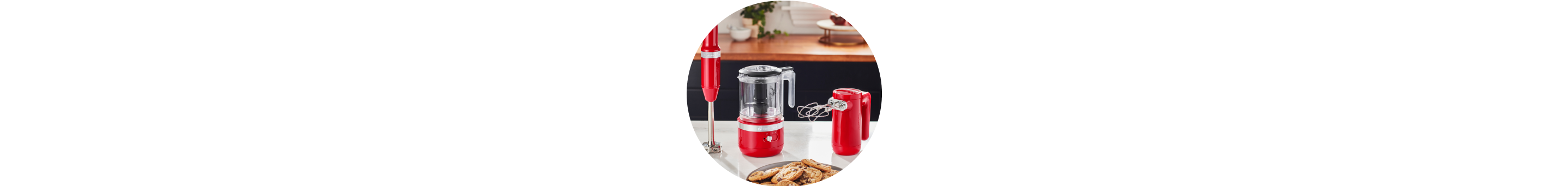 Passion Red KitchenAid® Cordless Immersion Blender, Food Chopper, and Hand Mixer on white countertop.