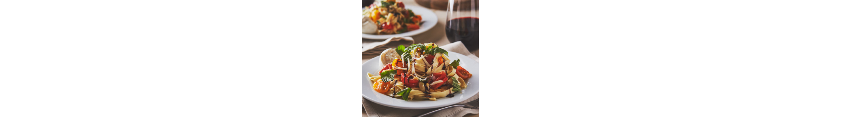 Homemade fettuccine with tomatoes and fresh herbs