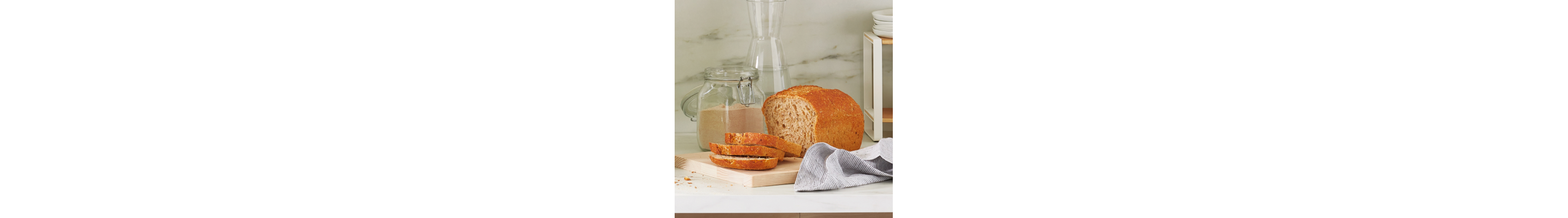 Sliced banana bread on top of wood cutting board