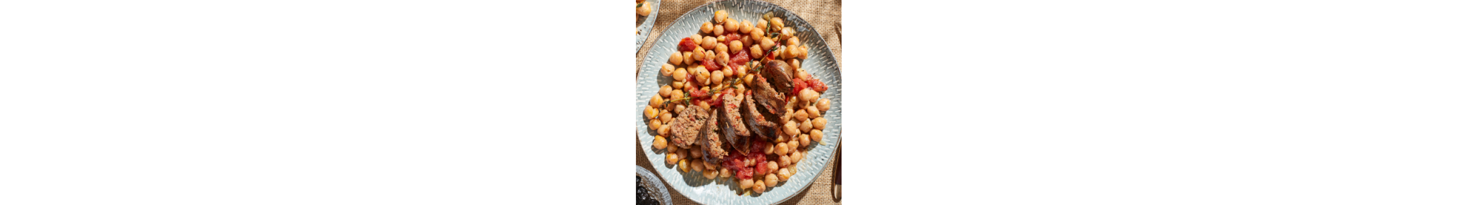 Sausage on a bed of garbanzo beans