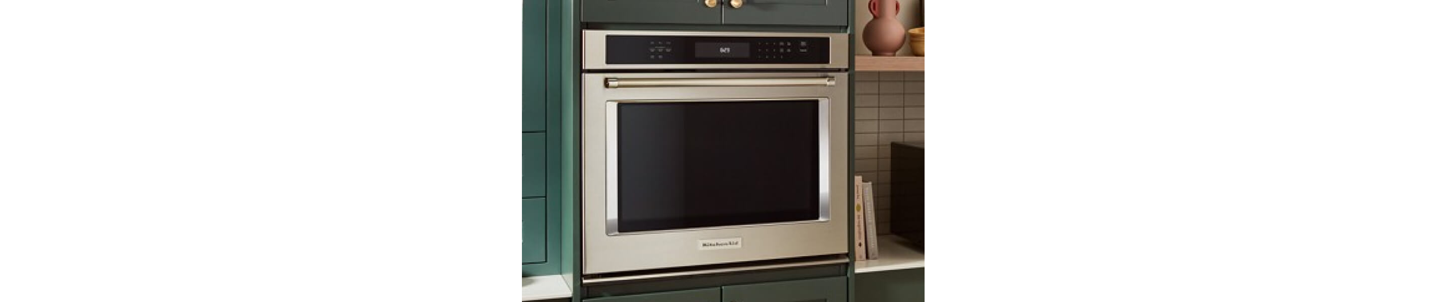 KitchenAid® wall oven in blue-green cabinetry