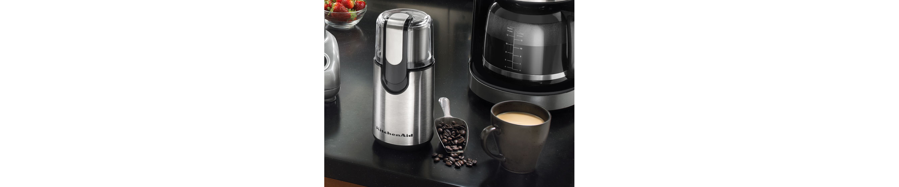KitchenAid® coffee blade grinder and cup of coffee