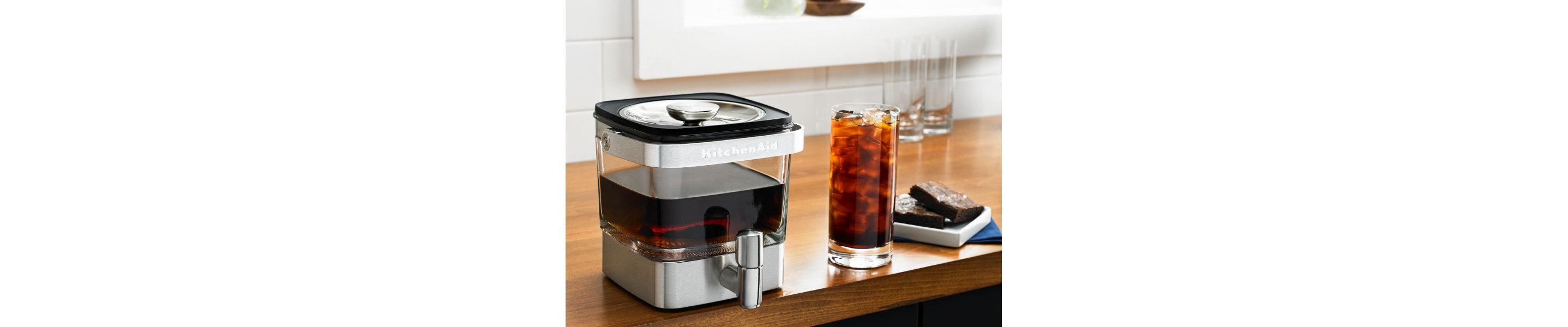 KitchenAid® cold brew coffee maker and glass of cold brew