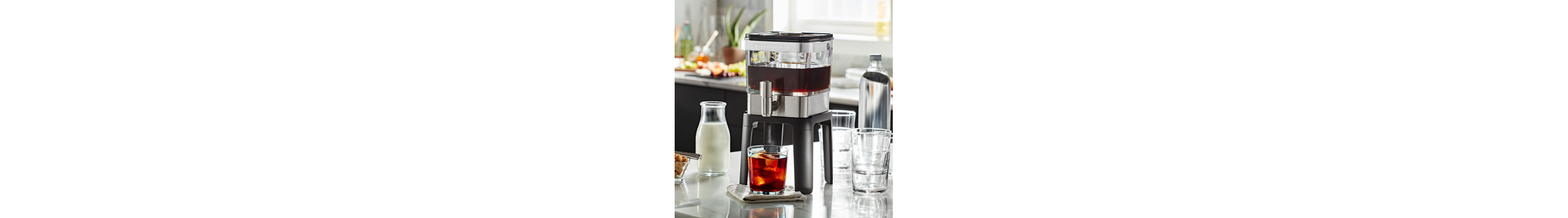 KitchenAid® Cold Brew Maker next to cold brew ingredients