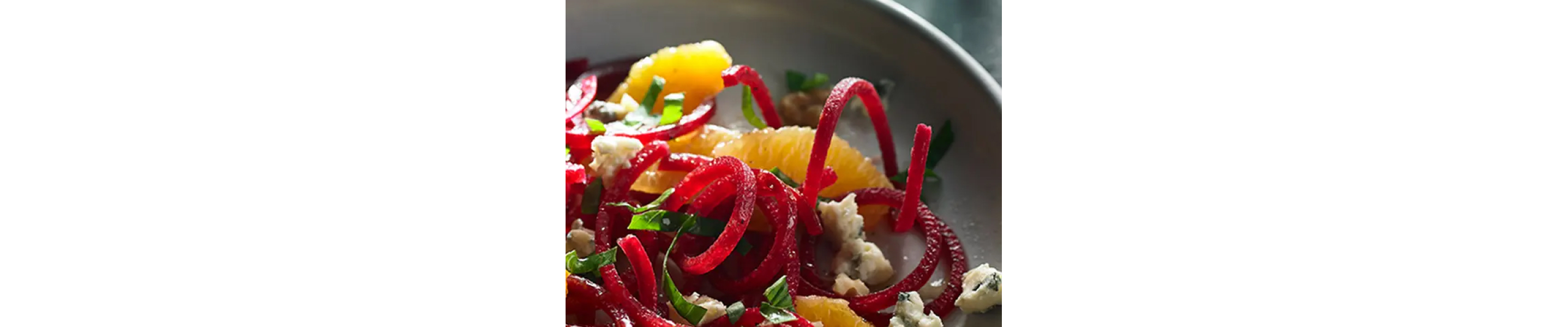 Salad made with spiralized beetroot, oranges and blue cheese