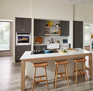 Stainless steel KitchenAid® Wall Oven and Built-in Side-by-Side Refrigerator in open kitchen