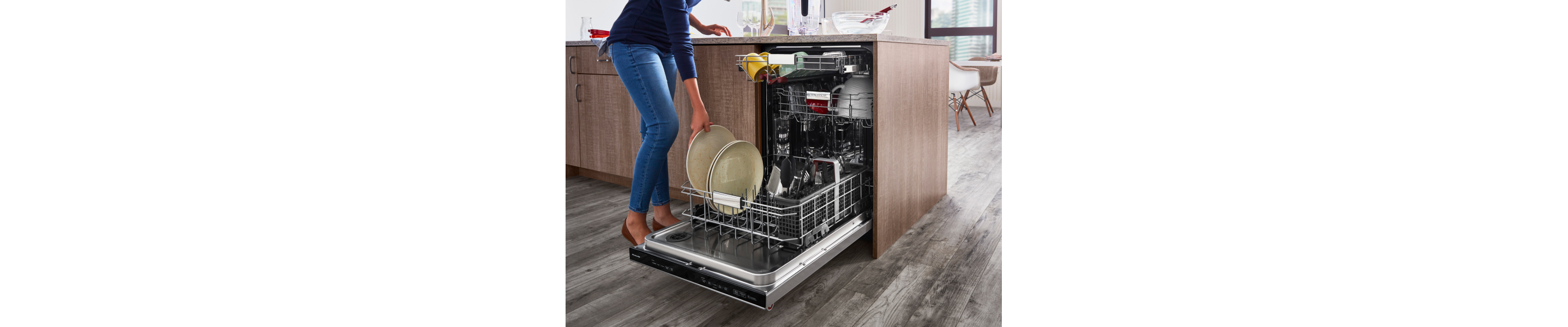 Woman loading dishes into a dishwasher