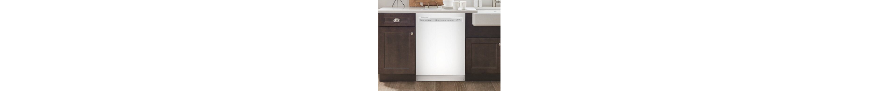 Stainless steel front control dishwasher next to dark cabinets