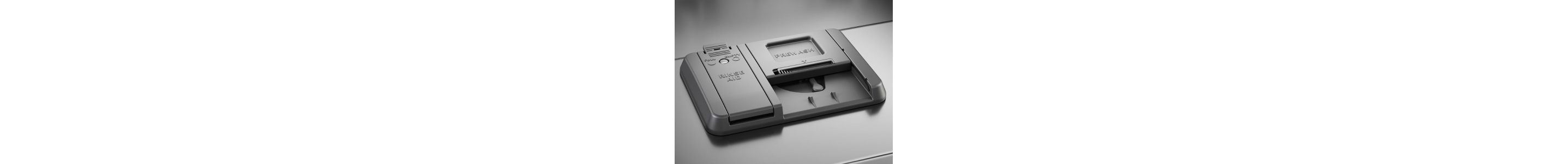 A closeup of a KitchenAid® dishwasher rinse aid dispenser.