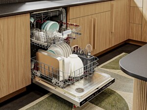 Open loaded dishwasher with racks pulled out 