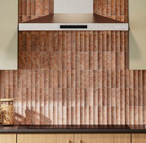 KitchenAid® range hood between cream colored cabinets