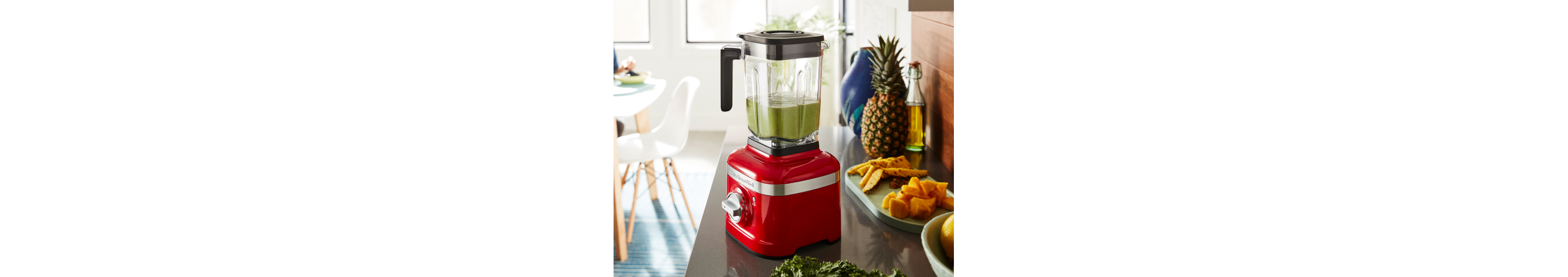 KitchenAid® blender on a counter with green smoothie