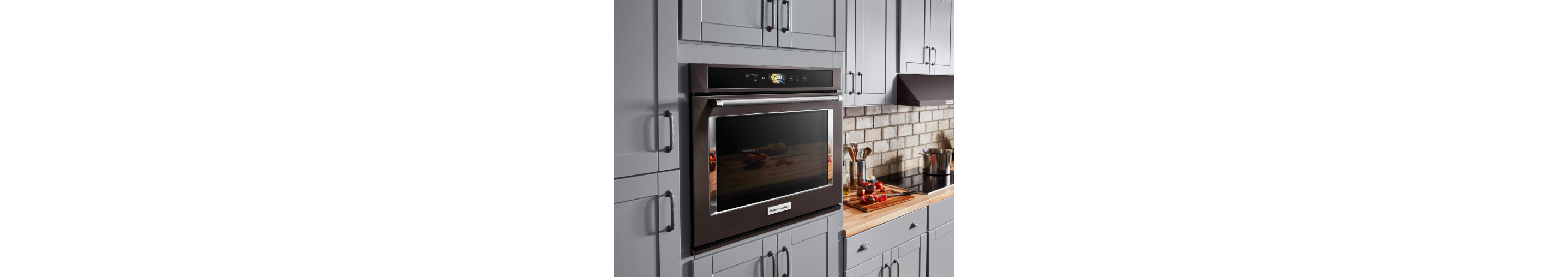 KitchenAid® wall oven among blue cabinets 