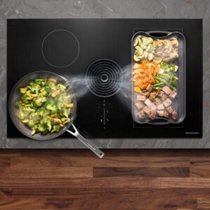 Two pans on an electric cooktop