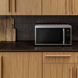 Microwave on a black countertop