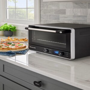 Countertop oven on a white kitchen counter