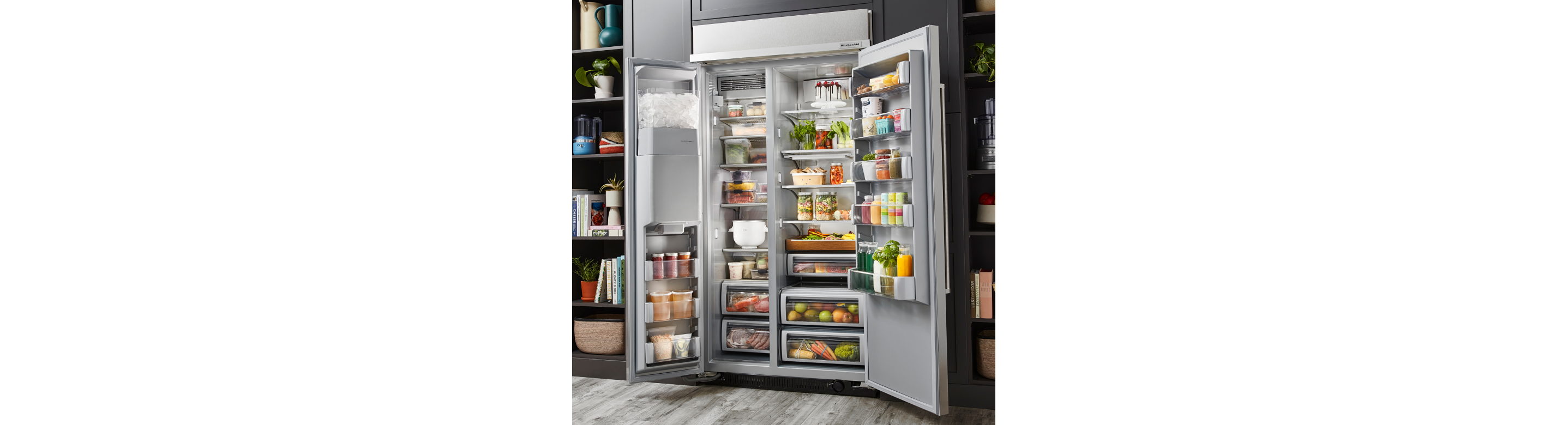 Open, stocked side-by-side refrigerator