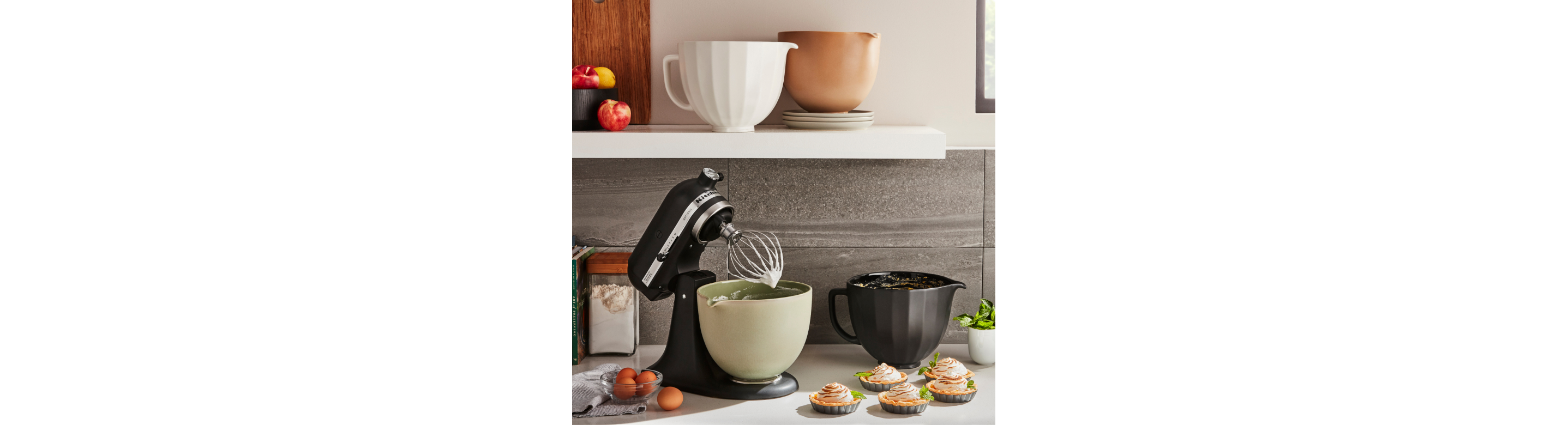 Stand mixer with bowls in multiple colors