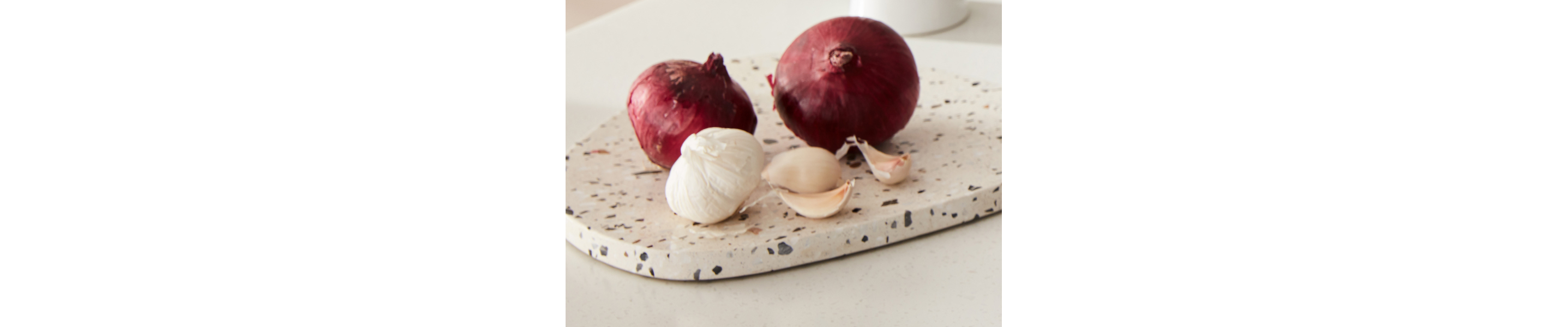 Garlic and onion on a cutting board