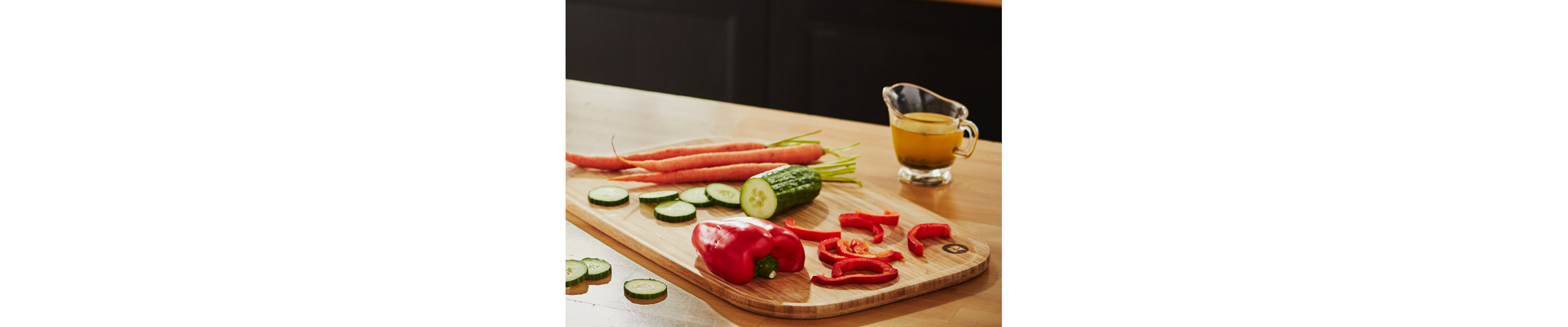 Bell pepper, cucumber and carrot on a cutting board