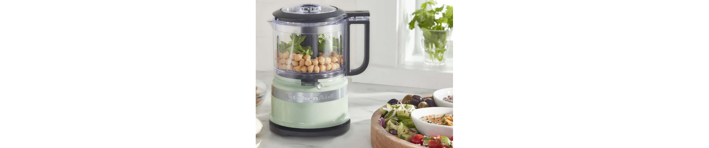 Light green KitchenAid® food chopper filled with chickpeas and greens