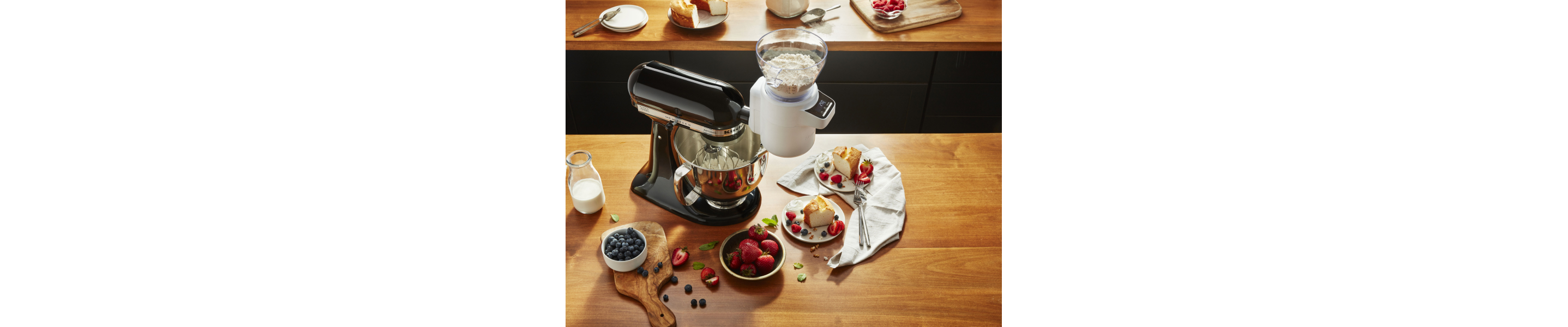 Black KitchenAid® stand mixer with the Sifter + Scale Attachment full of flour
