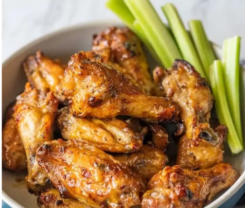 Plate of chicken wings and celery