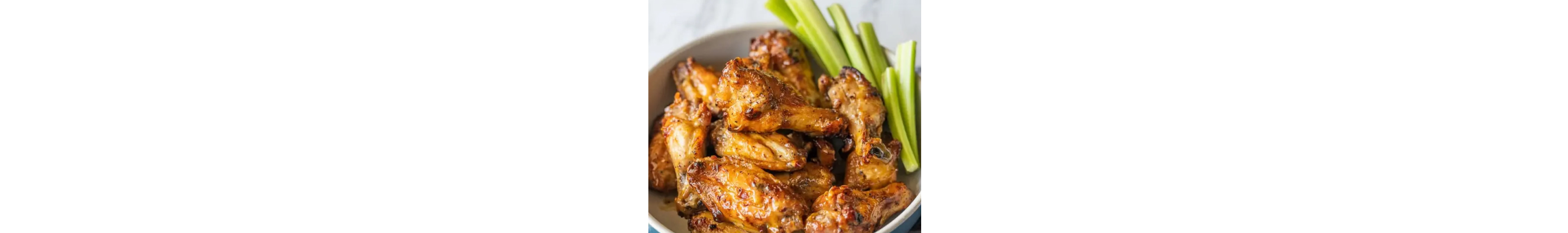 Plate of chicken wings and celery