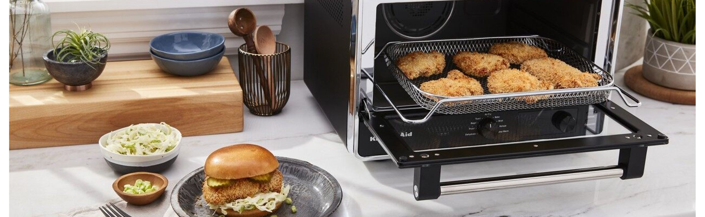 Countertop with KitchenAid® countertop oven with various fried foods