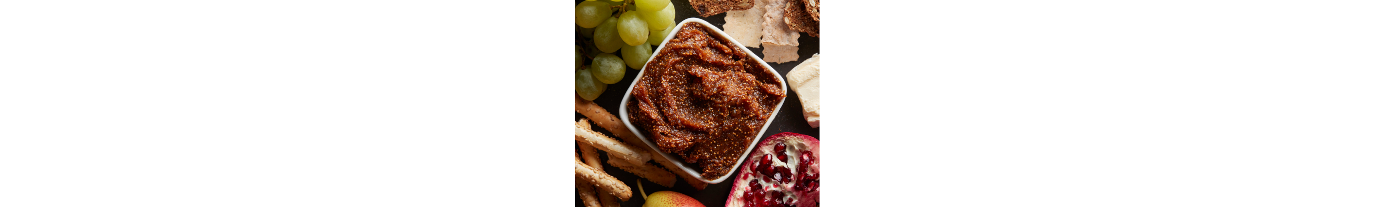 Pureed fig jam surrounded by food for dipping