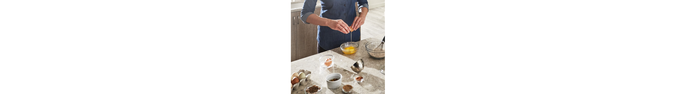 Cracking eggs into a bowl