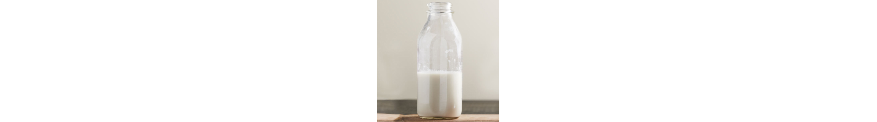 A half-full bottle of milk