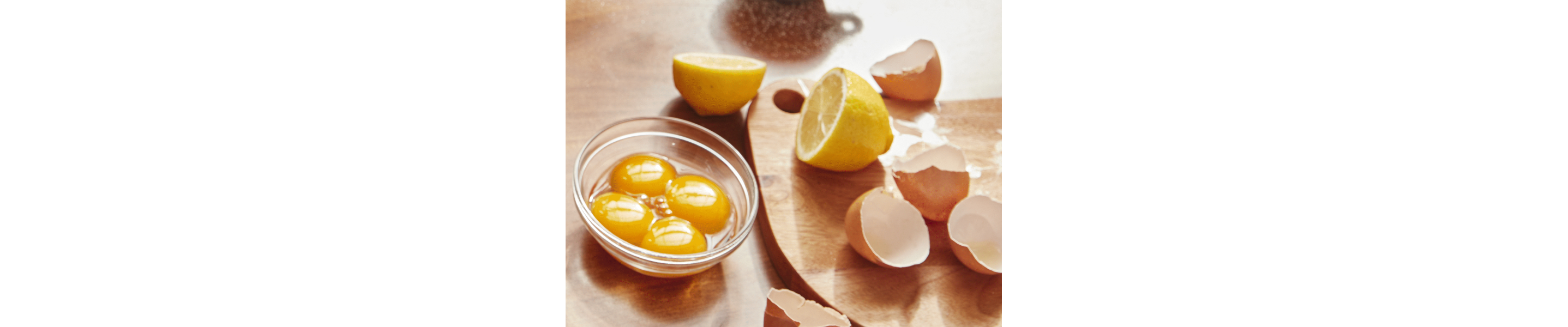 Lemon halves and cracked eggs