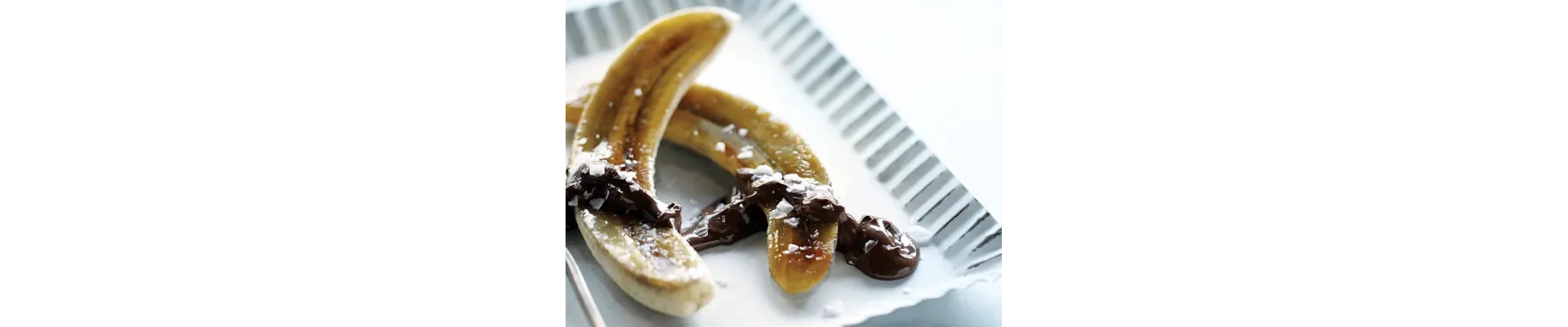 Caramelized bananas on white serving tray