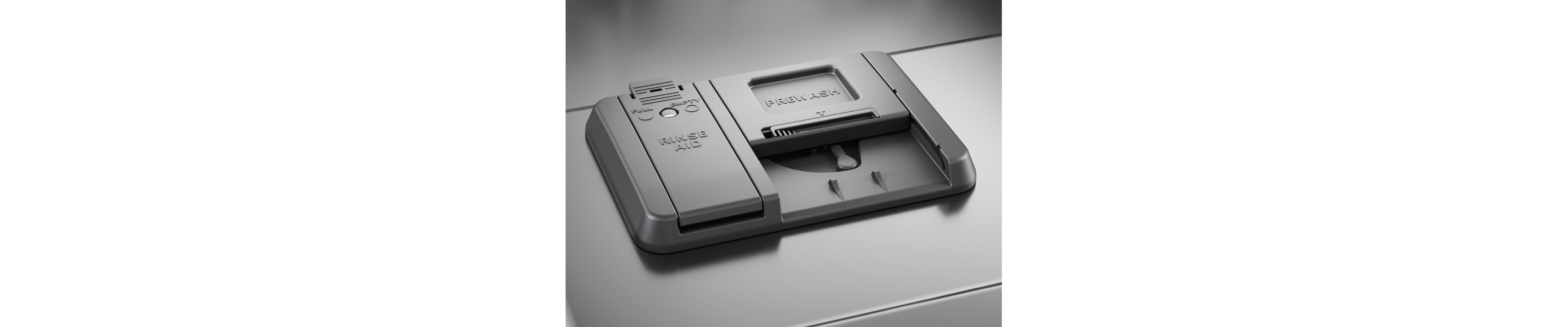 The detergent dispenser of a KitchenAid® dishwasher.