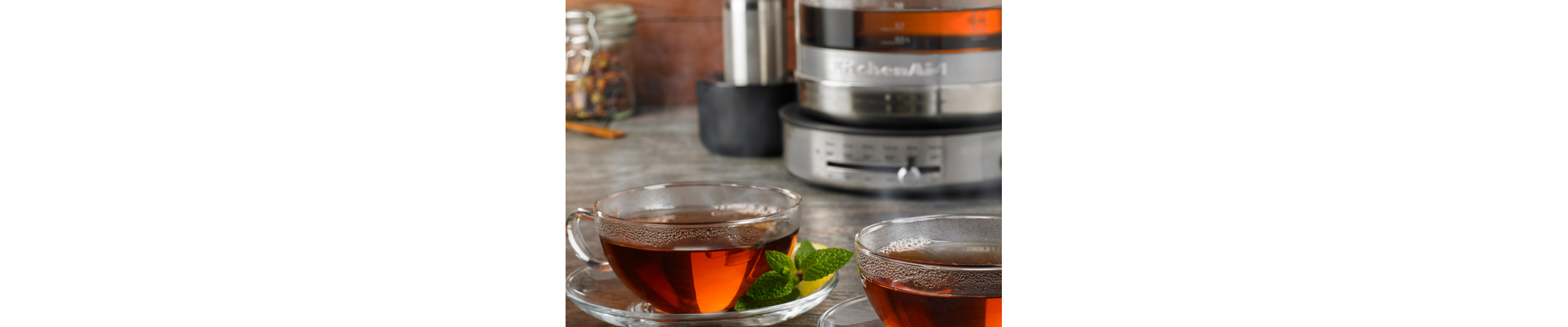 Two glass mugs of herbal tea with mint