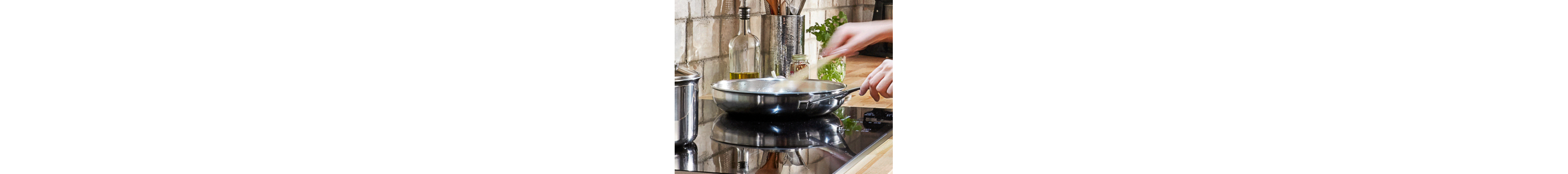 Hand whisking ingredients in a skillet